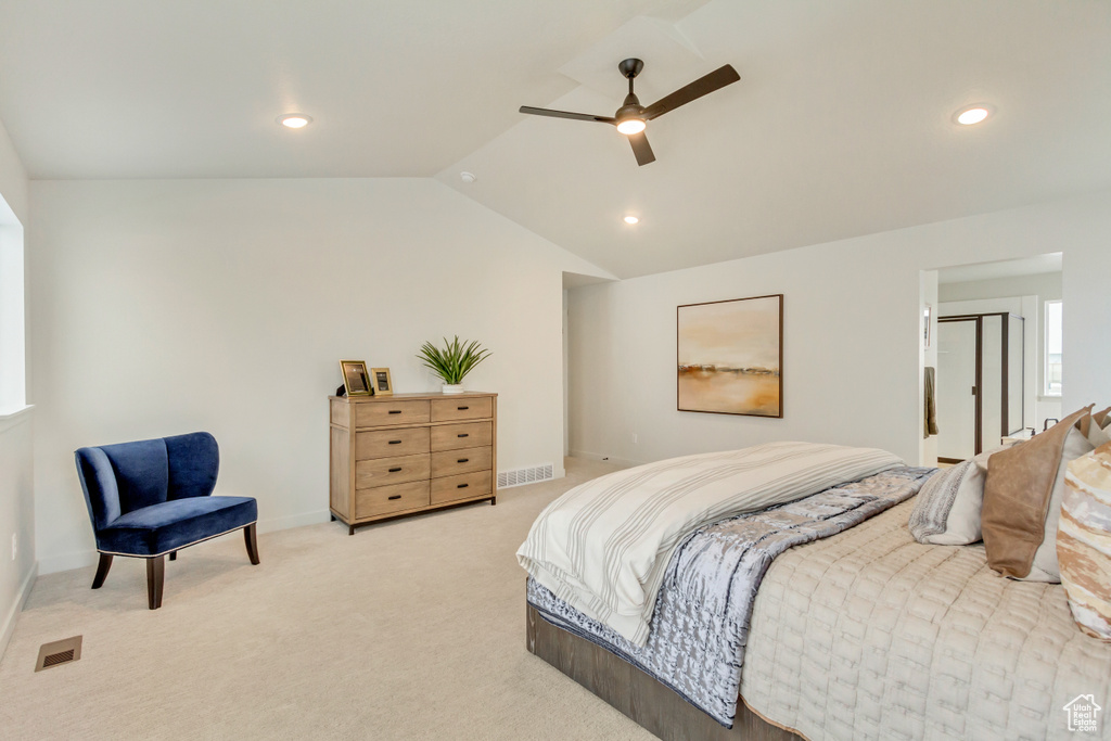 Bedroom featuring vaulted ceiling, light carpet, baseboards, visible vents, and recessed lighting