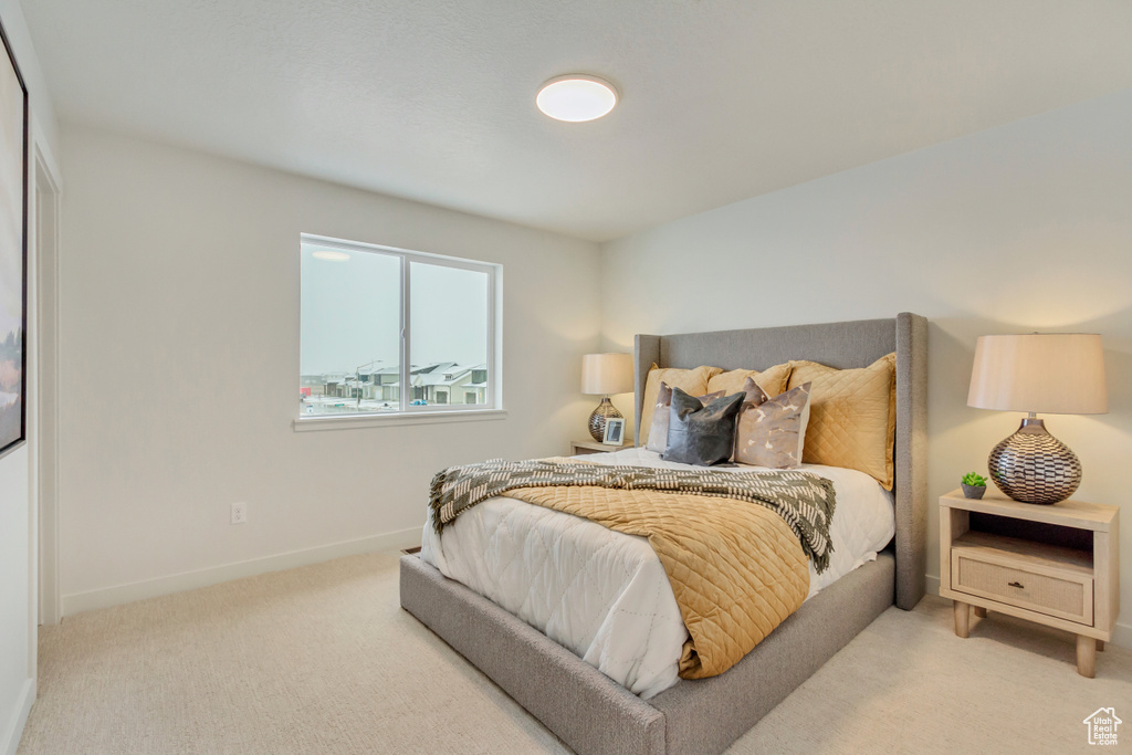 Bedroom with baseboards and carpet flooring