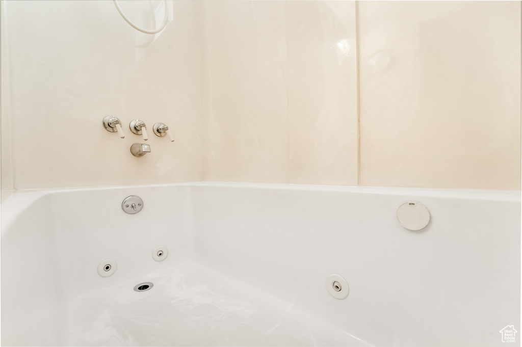 Full bath featuring a whirlpool tub
