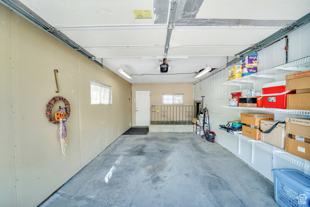 Garage featuring a garage door opener