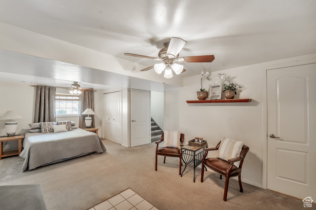 Bedroom featuring ceiling fan and light carpet
