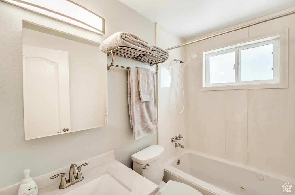 Full bathroom with  shower combination, a sink, and toilet