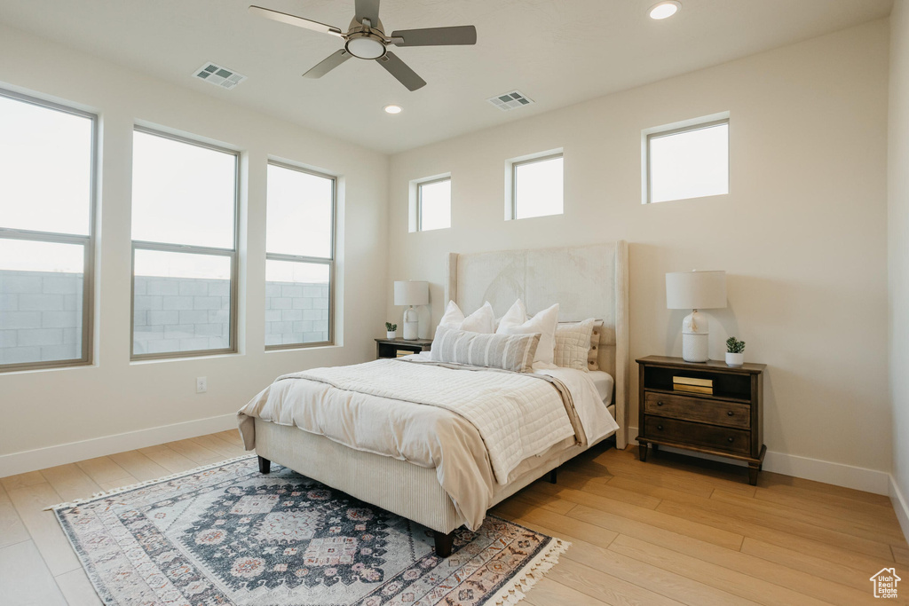 Bedroom with recessed lighting, light wood-type flooring, and visible vents