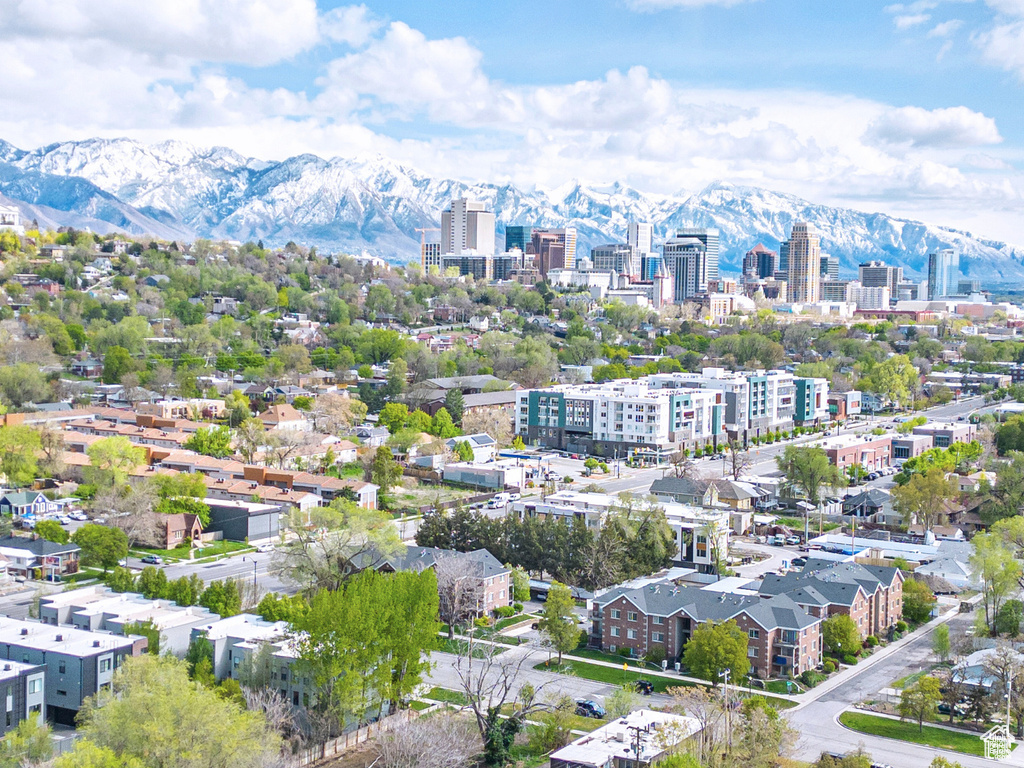 Drone / aerial view with a view of city and a mountain view