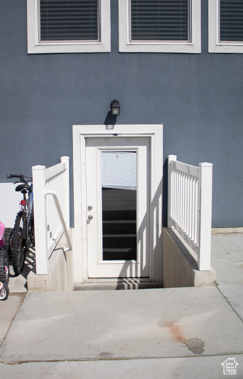 Property entrance with stucco siding