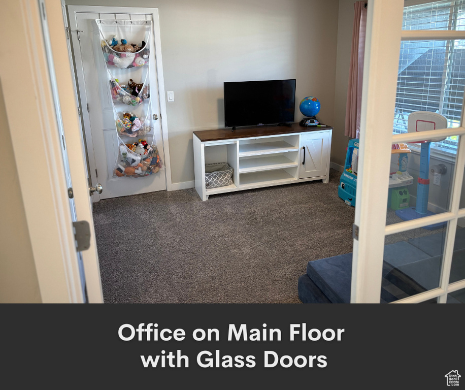 Bedroom with carpet floors and baseboards