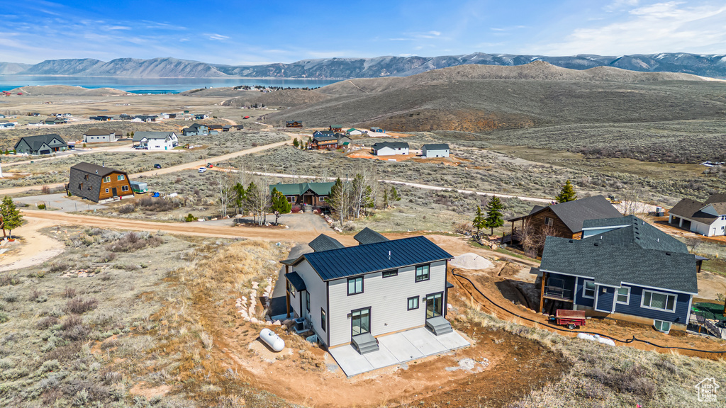 Bird's eye view featuring a water and mountain view