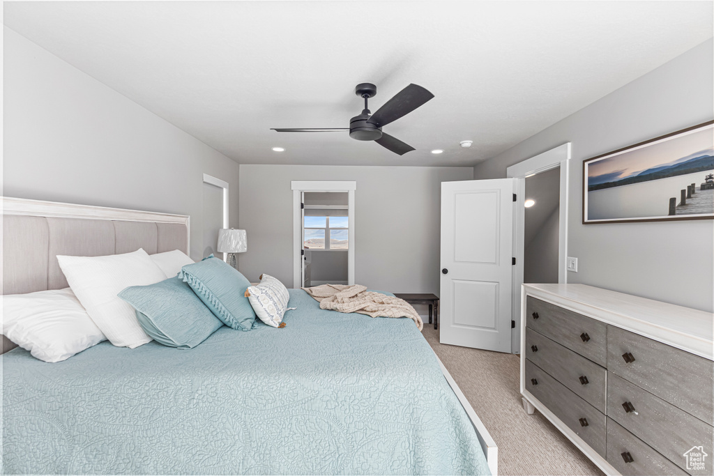 Bedroom with recessed lighting, a ceiling fan, and light carpet