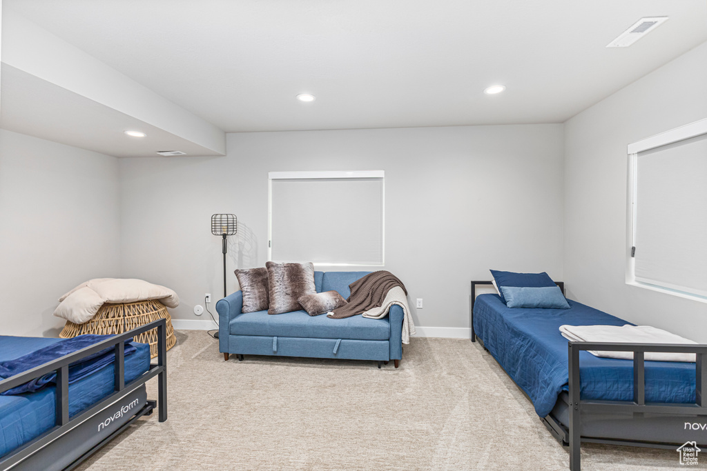 Carpeted bedroom with recessed lighting, baseboards, and visible vents