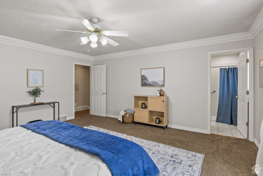 Bedroom with ceiling fan, carpet floors, baseboards, visible vents, and ornamental molding
