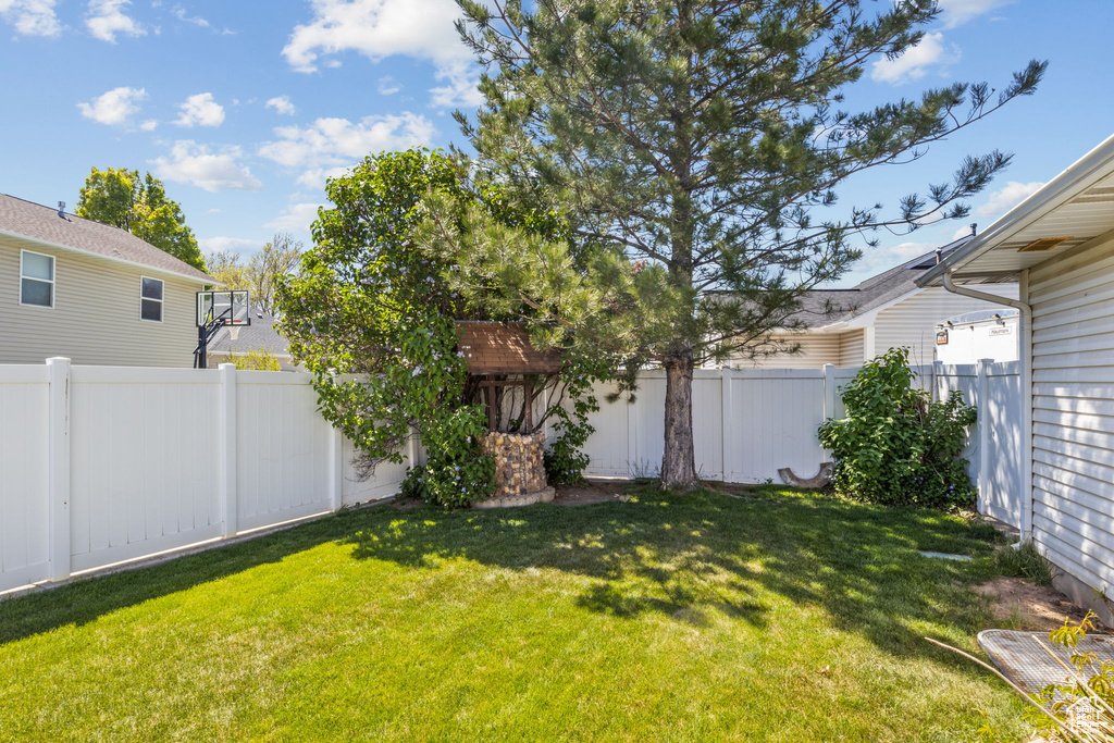 View of yard with a fenced backyard