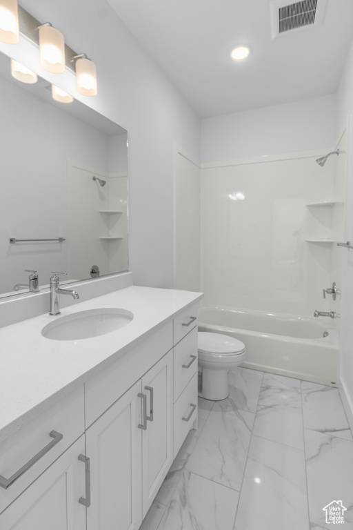 Bathroom with visible vents, vanity, toilet, recessed lighting, and  shower combination