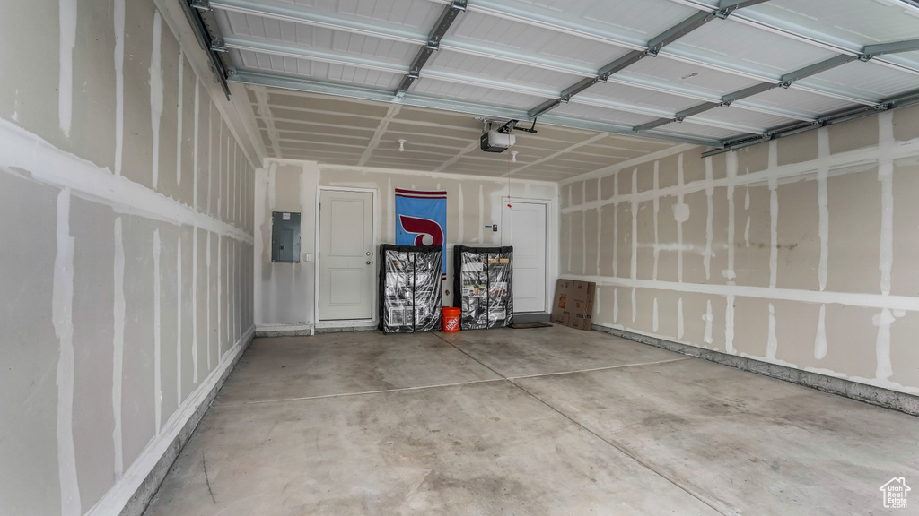 Garage with a garage door opener and electric panel