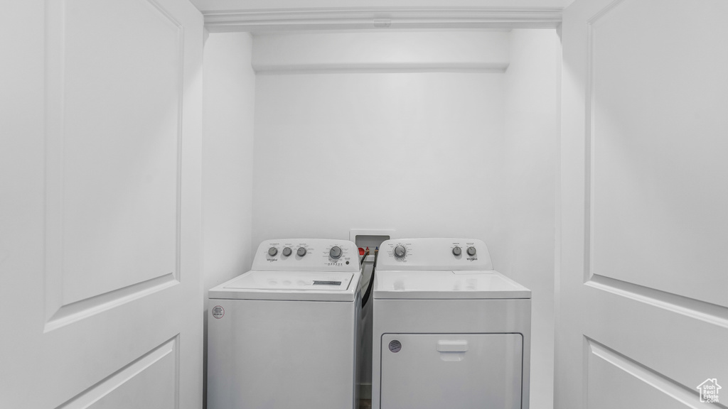 Laundry area featuring laundry area and washing machine and dryer