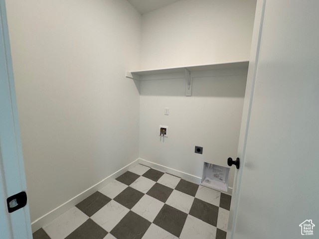 Washroom featuring washer hookup, hookup for an electric dryer, baseboards, and tile patterned floors