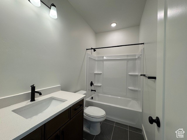 Full bath featuring tile patterned floors, toilet, bathtub / shower combination, and vanity