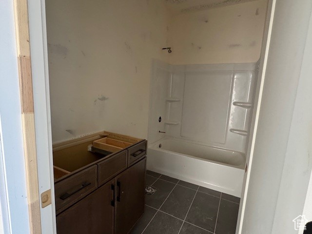 Full bathroom with tile patterned floors, vanity, and  shower combination