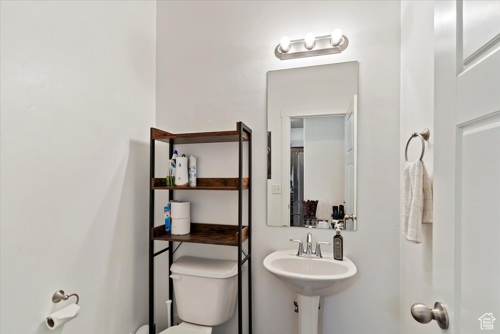 Half bath featuring toilet