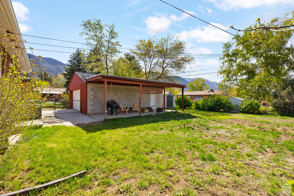 Exterior space with a mountain view and fence