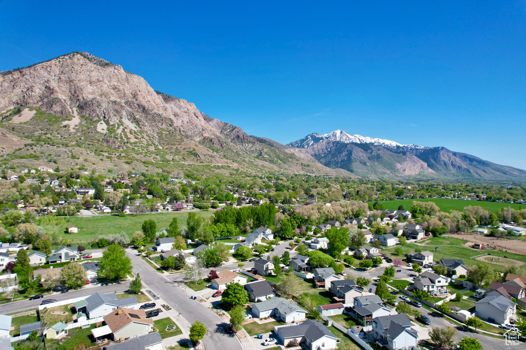 Birds eye view of property featuring a mountain view and a residential view