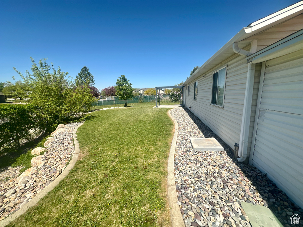 View of yard with fence