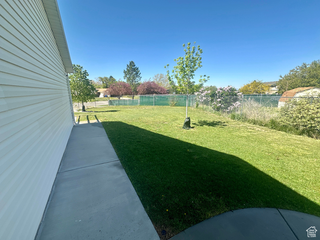 View of yard with fence
