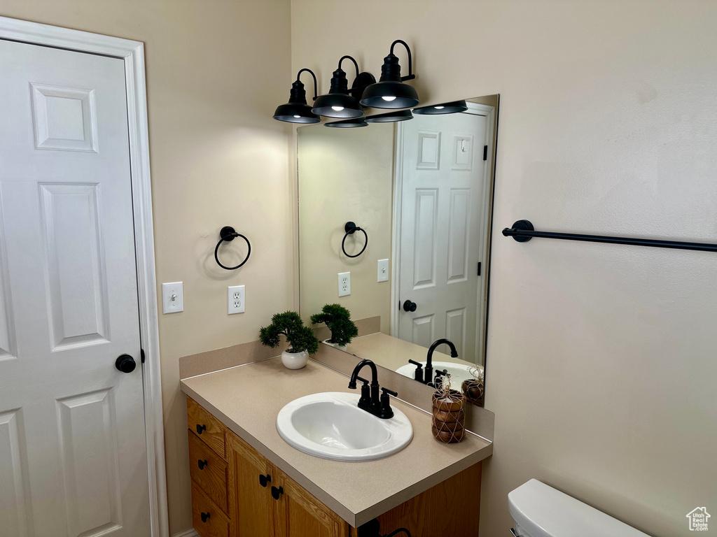 Bathroom featuring vanity and toilet