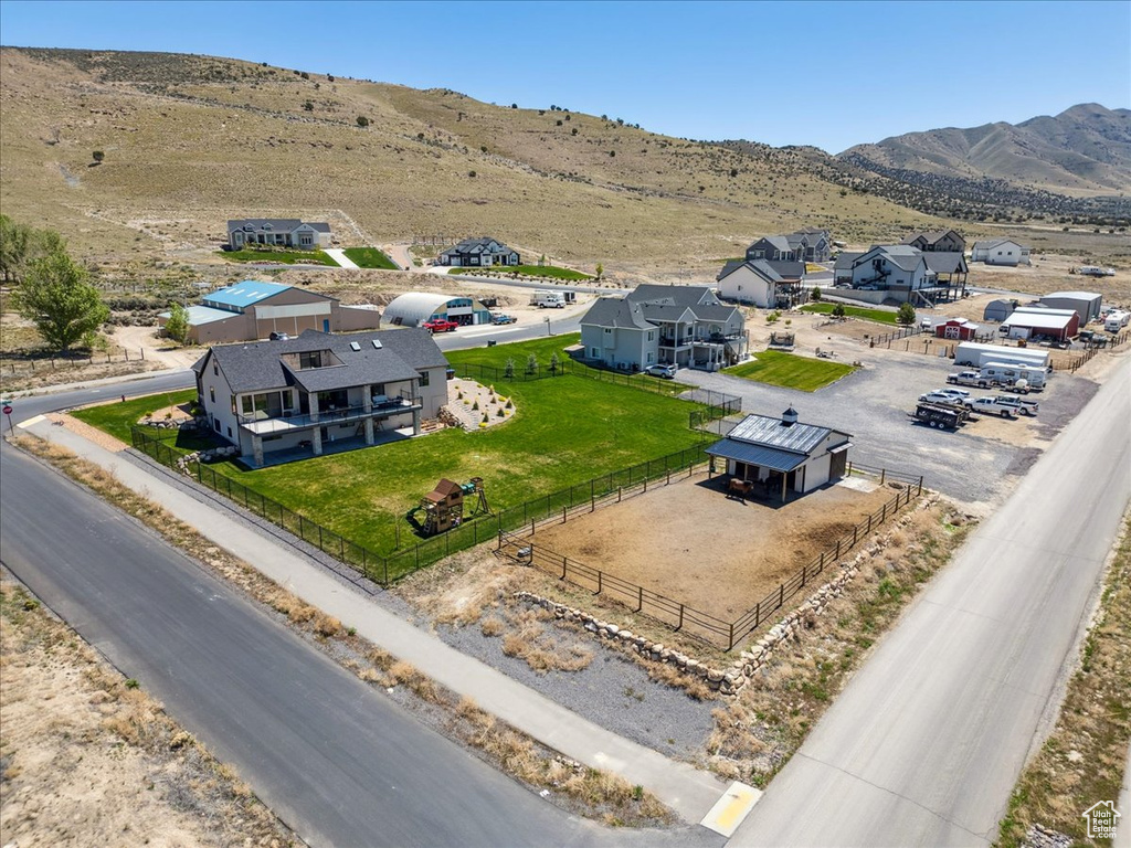 Aerial perspective of suburban area with a mountainous background