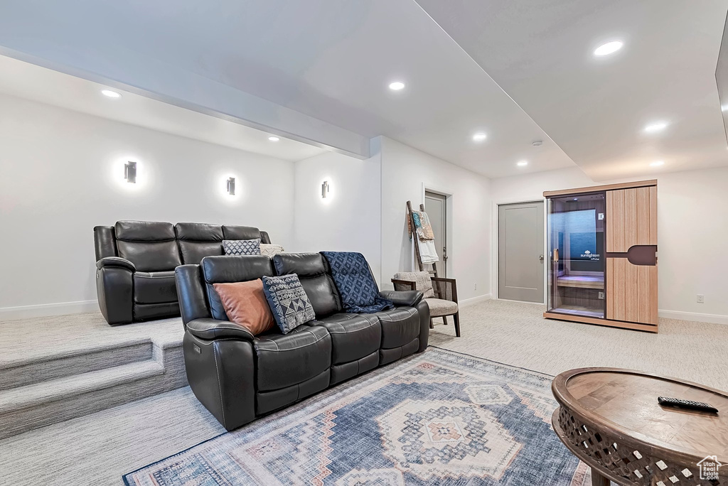 Living area featuring recessed lighting, baseboards, and light colored carpet