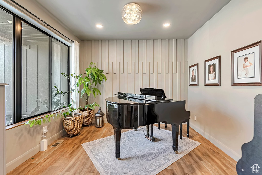 Living area featuring recessed lighting, baseboards, visible vents, and wood finished floors
