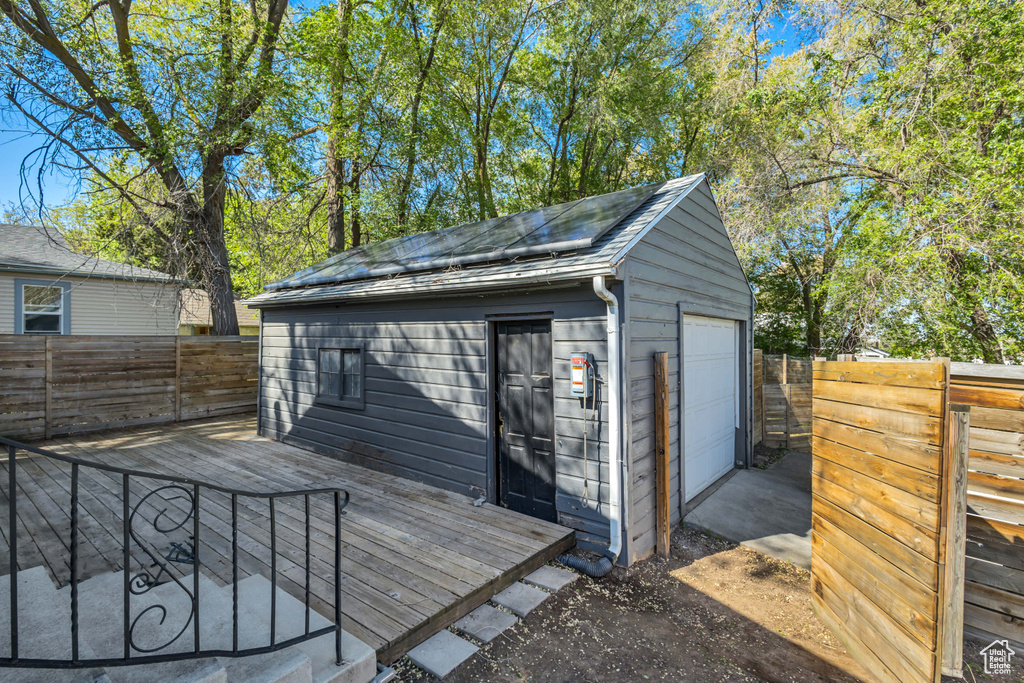 View of outbuilding with a fenced backyard and an outbuilding