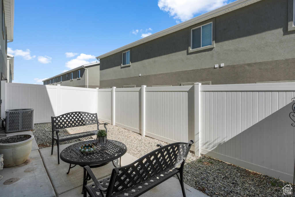 View of patio / terrace featuring a fenced backyard and central AC