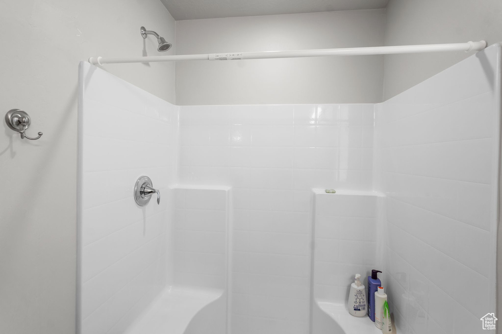 Full bath featuring a shower