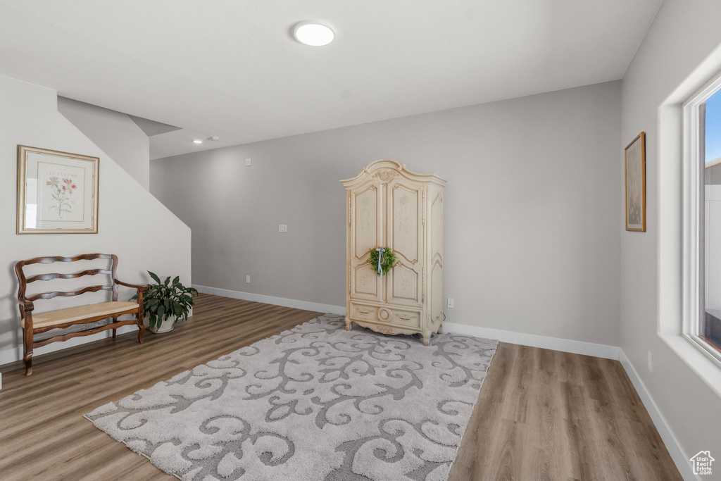 Sitting room featuring baseboards and light wood-style flooring
