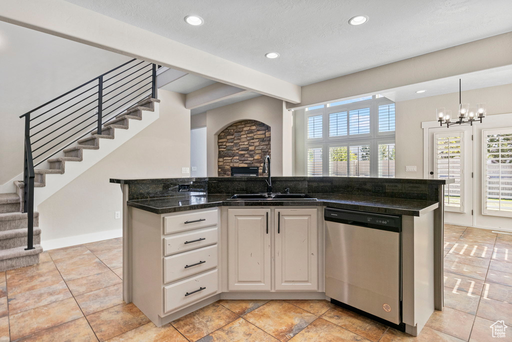 Kitchen featuring a sink, an inviting chandelier, recessed lighting, and dishwasher