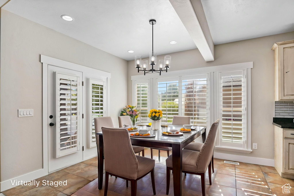 Dining room featuring visible vents, baseboards, beamed ceiling, a notable chandelier, and recessed lighting