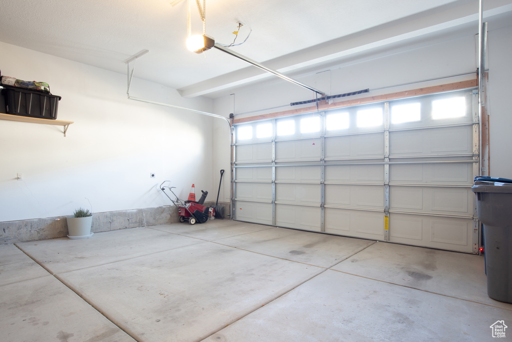 Garage featuring a garage door opener