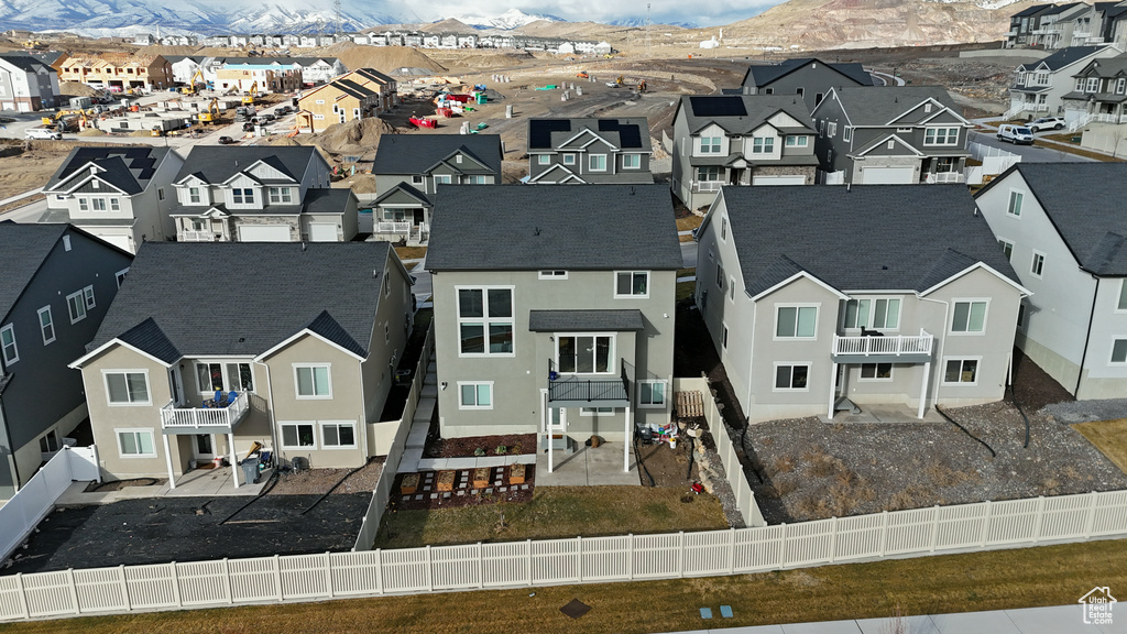 Birds eye view of property with a residential view and a mountain view