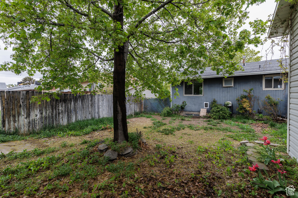 View of yard with a fenced backyard