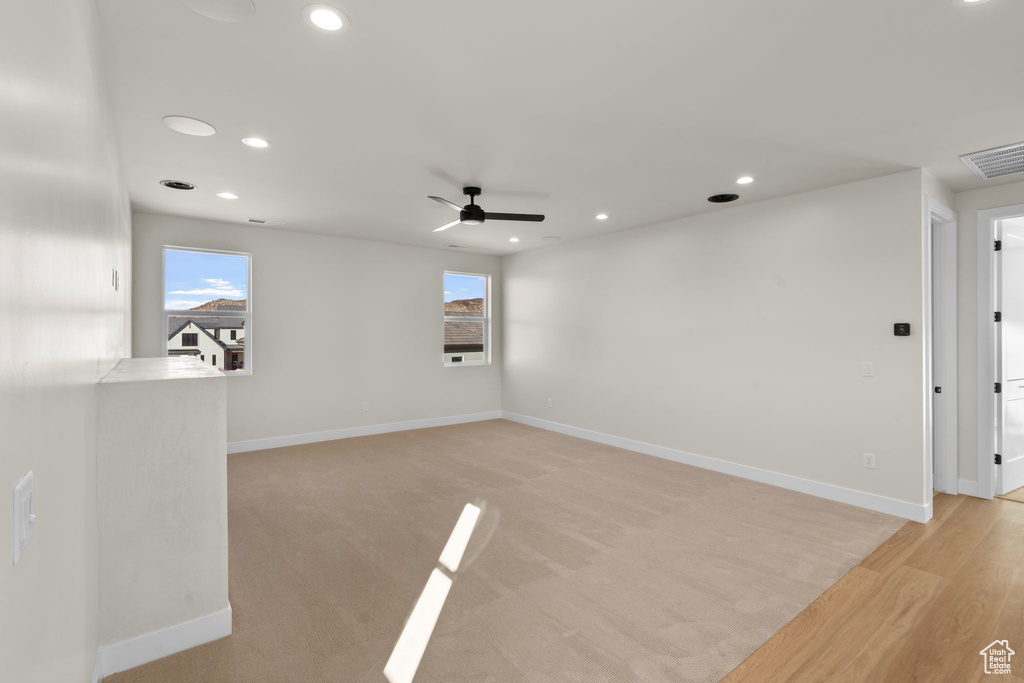 Empty room featuring baseboards, ceiling fan, recessed lighting, and visible vents