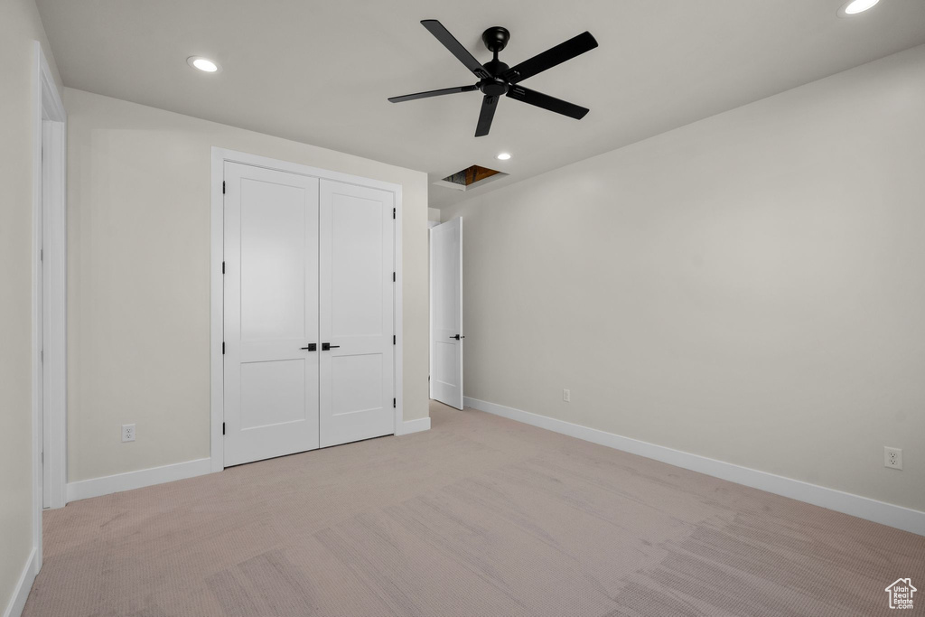 Unfurnished bedroom featuring recessed lighting, baseboards, and light colored carpet