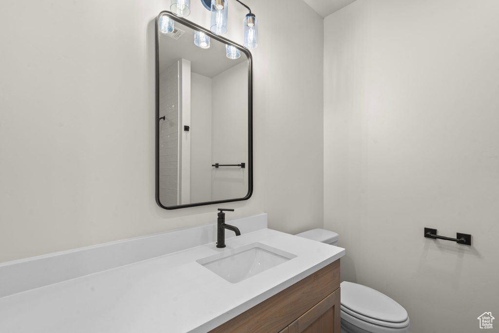 Bathroom with toilet and vanity