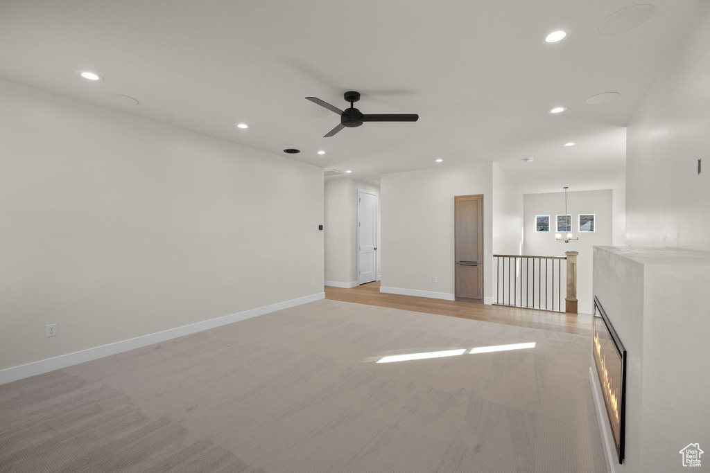 Empty room with baseboards, a ceiling fan, and recessed lighting