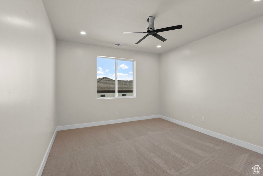 Spare room with baseboards, a ceiling fan, recessed lighting, and visible vents