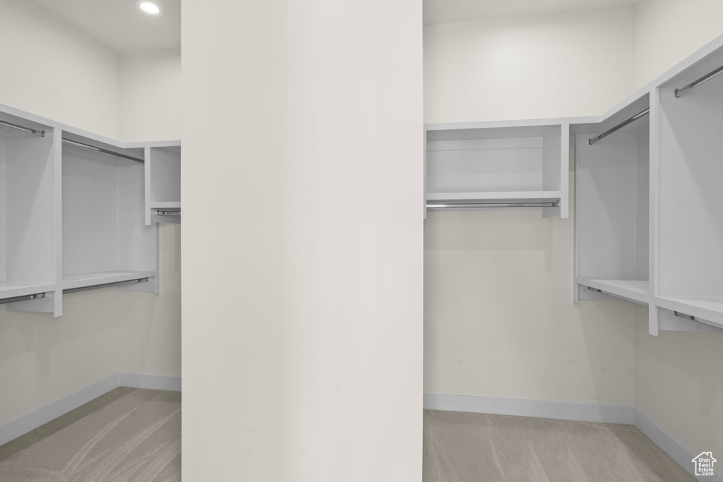 Spacious closet with carpet floors