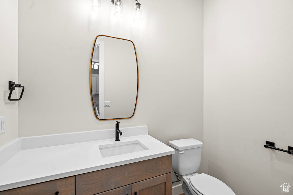 Half bath with vanity and toilet
