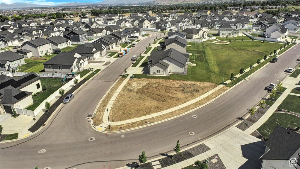 Birds eye view of property featuring a mountain view and a residential view