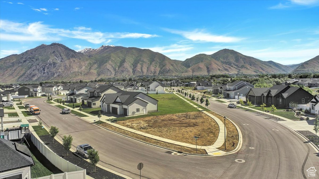 Property view of mountains with a residential view