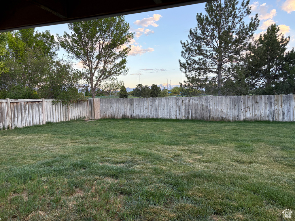 View of yard featuring fence