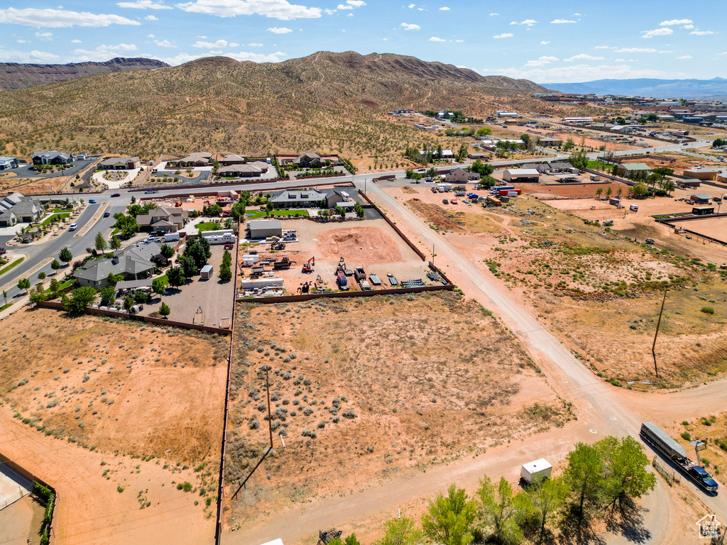 Birds eye view of property with a mountain view